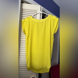 Bright yellow tunic top.